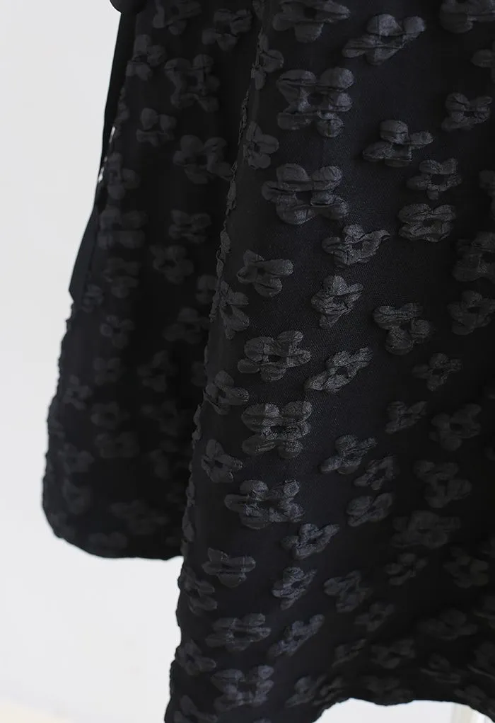 Jupe évasée à fleurs en relief avec nœud papillon